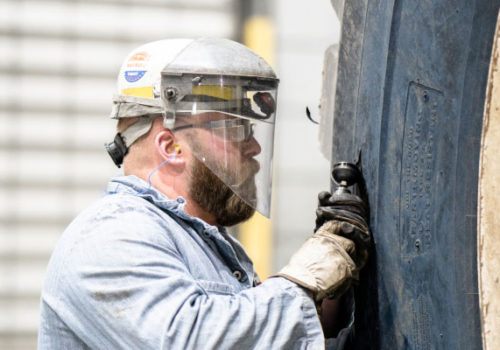 North American Coal Employee In Action Wearing Ppe, Hard Hat And Safety Glasses/face Shield